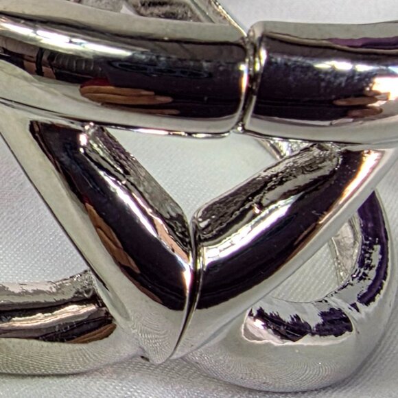 New Directions Silver Tone Knot Bangle Bracelet Featuring an Abstract Design - Picture 7 of 10